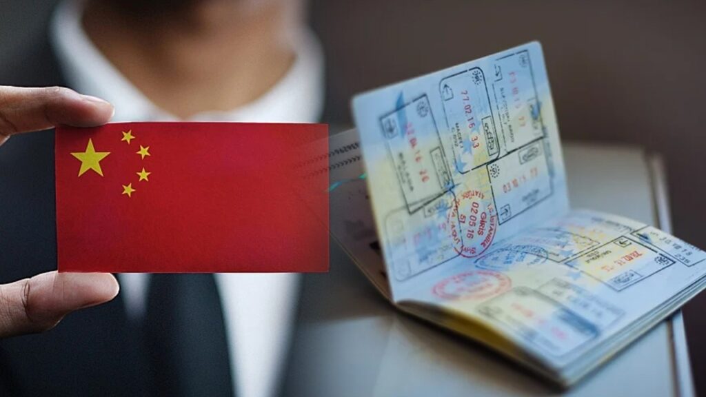 a person showing chinese flags in hand, chinese passport on right side. chinese new k visa