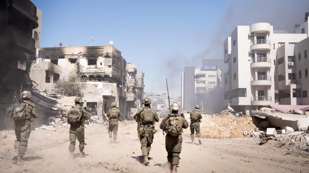 an image showing Israel soldiers walking in Gaza, this is one of Hamas's demands in the Gaza peace talks