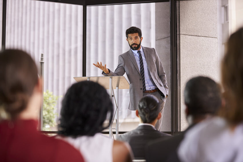 a man giving speech in office